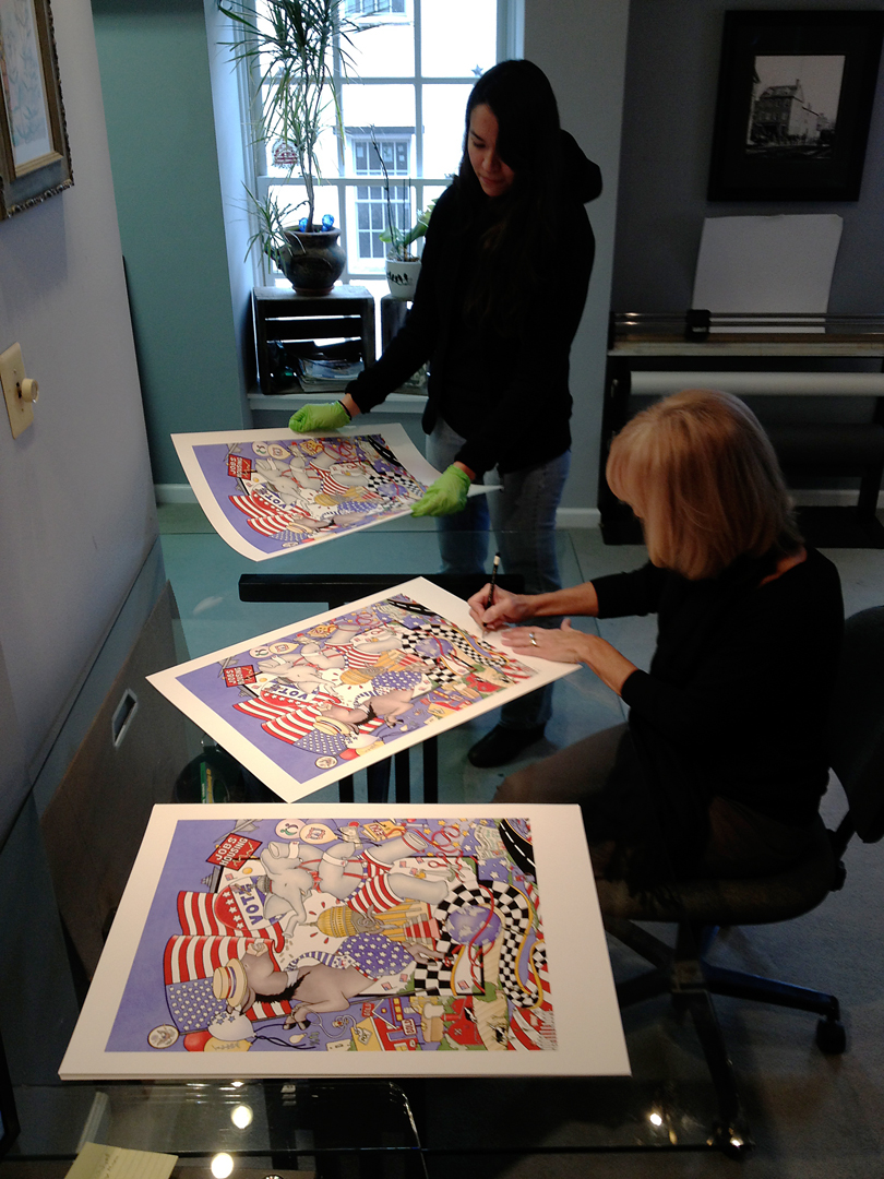 Artist Dana Scheurer signing prints at Old Town Editions