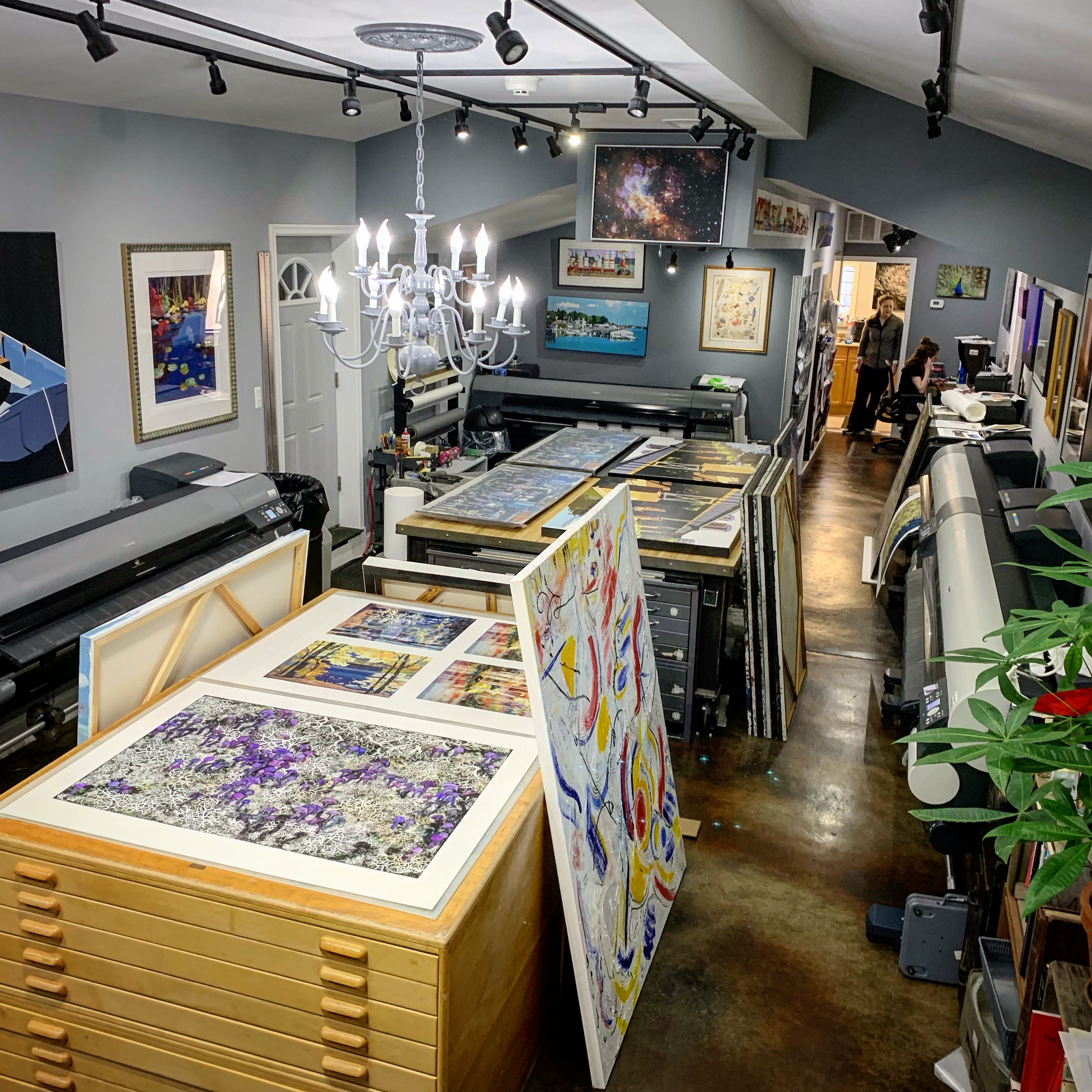 View of our studio in Alexandria Virginia, with fine art print examples and original artwork.