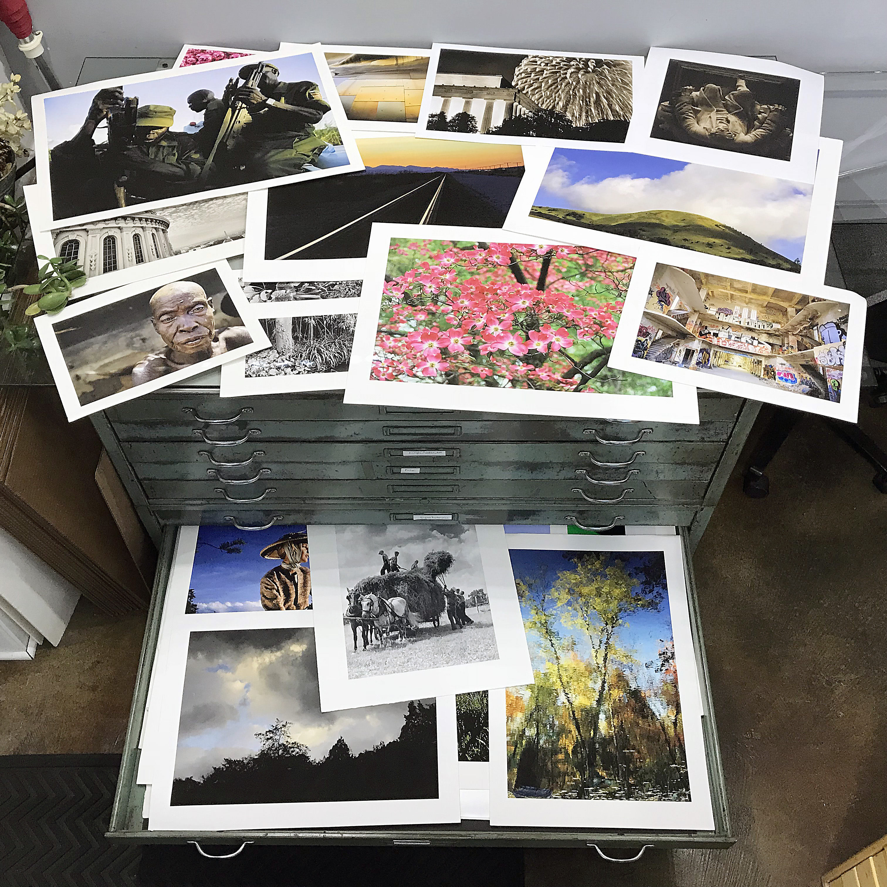 Our sample drawer open, with the table covered with sample prints.